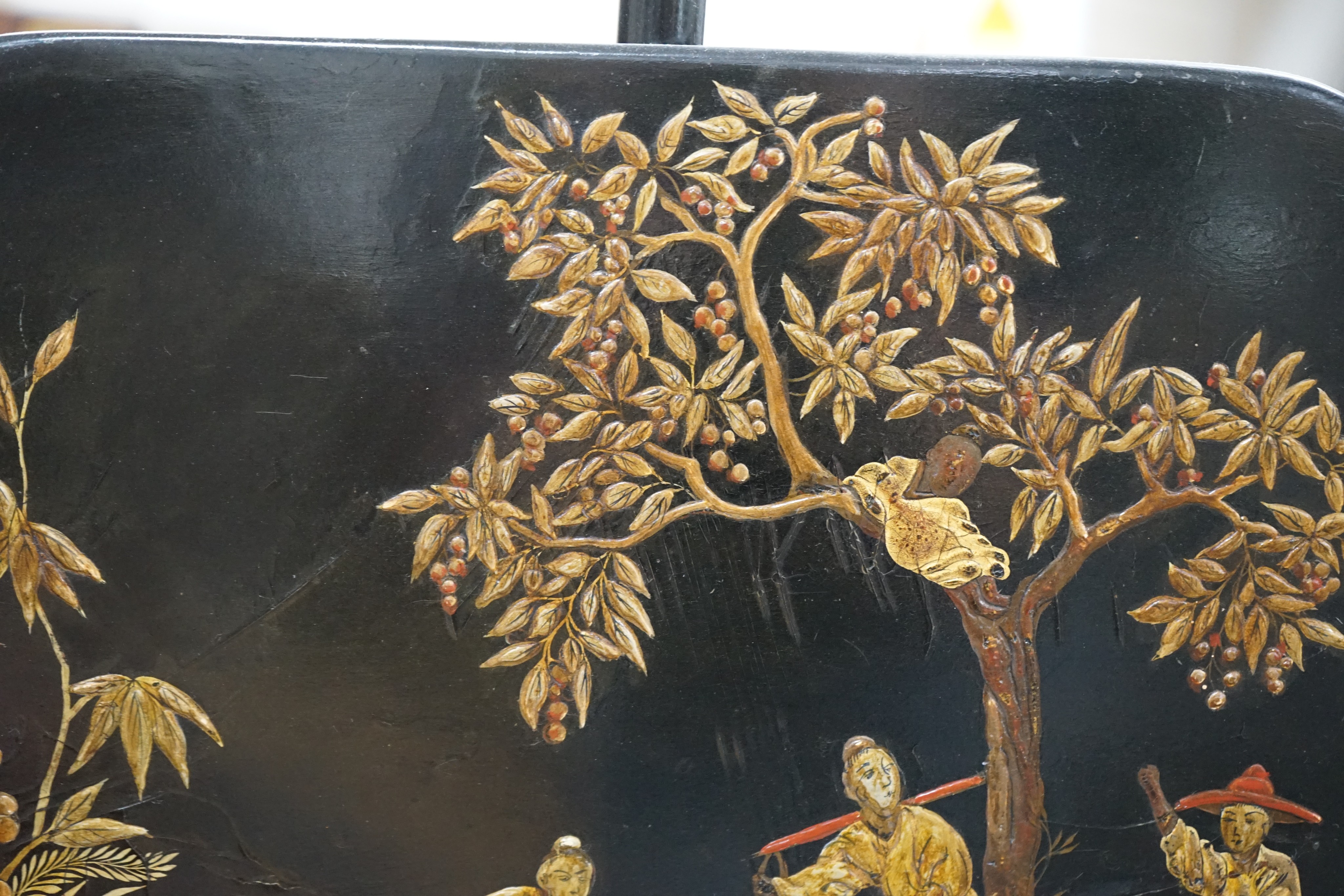 A pair of 19th century chinoiserie lacquer pole screens, height 152cm